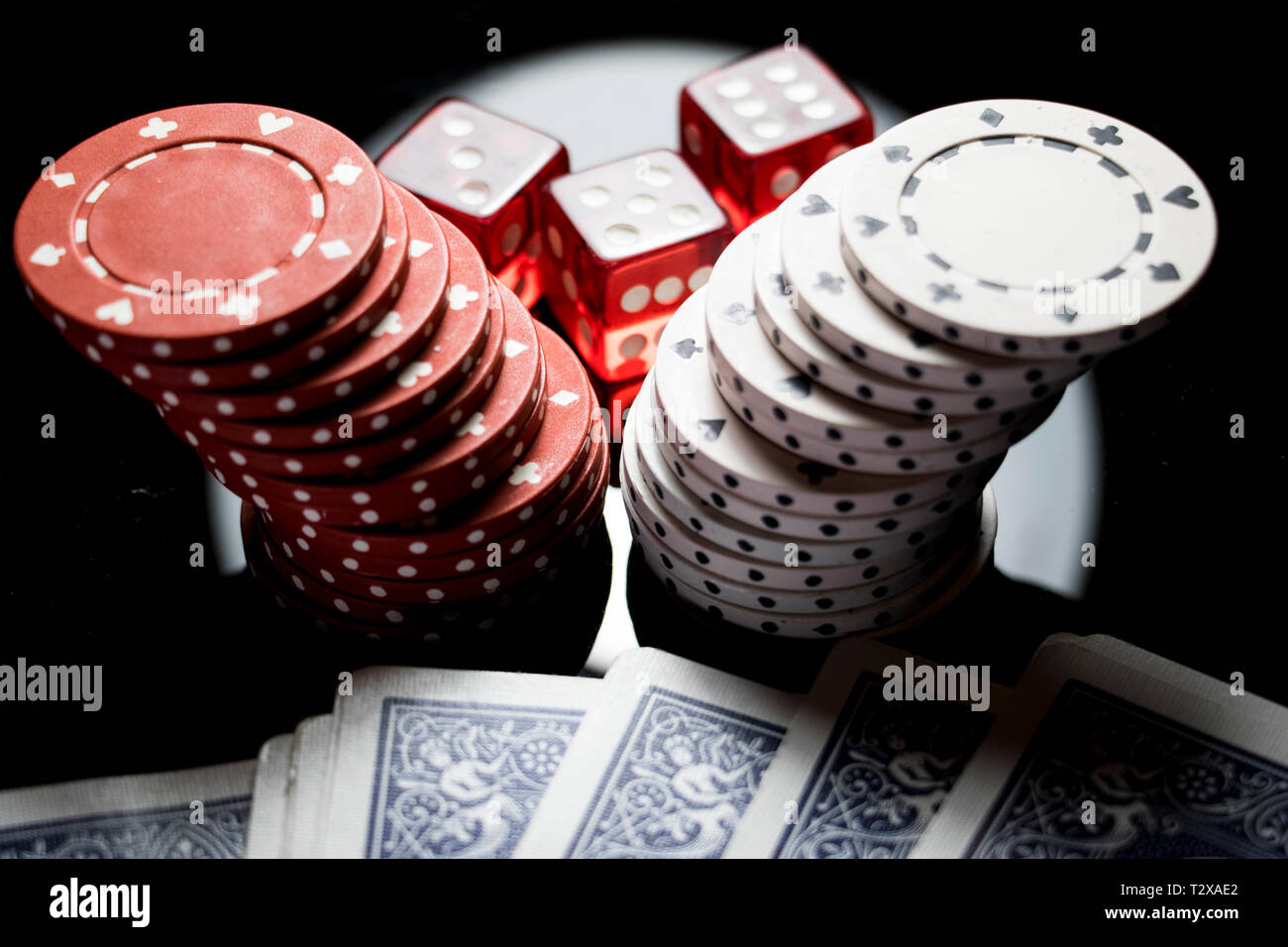 Stack of poker chips dice and cards playing games and betting at the