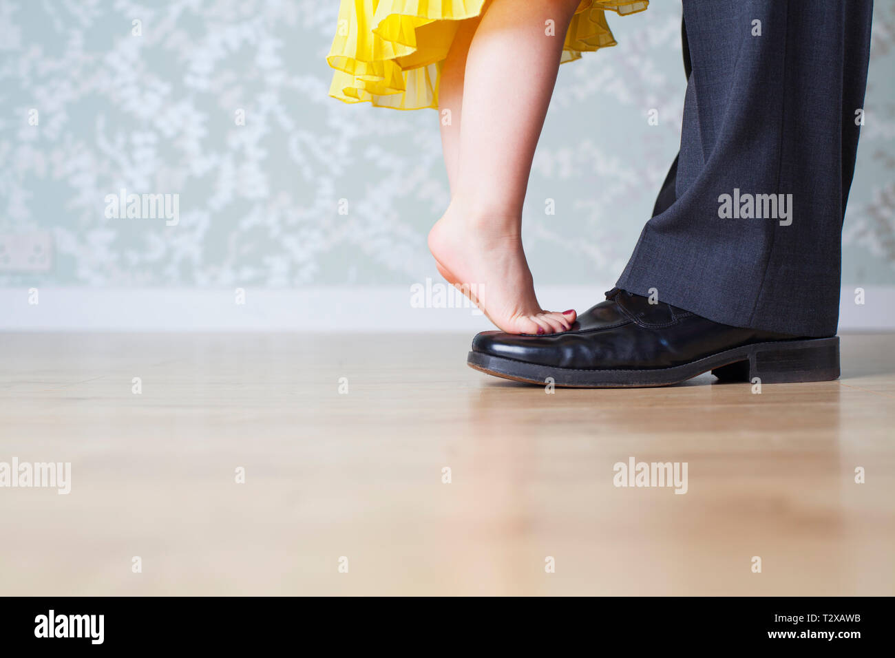 Young caucasian girl greeting her daddy from coming home from work Stock Photo