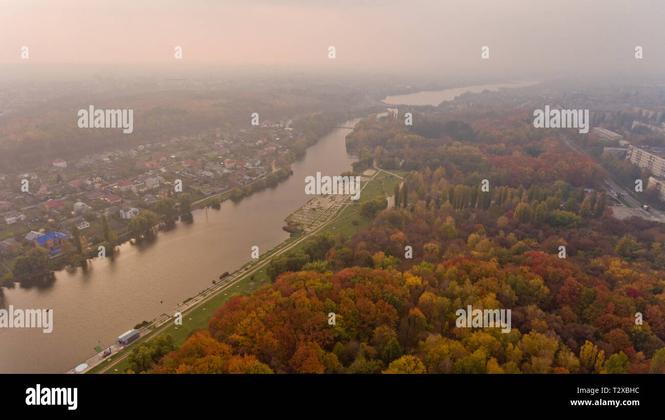 Aerial view of the autumn city park near the lake. Beautiful view of ...