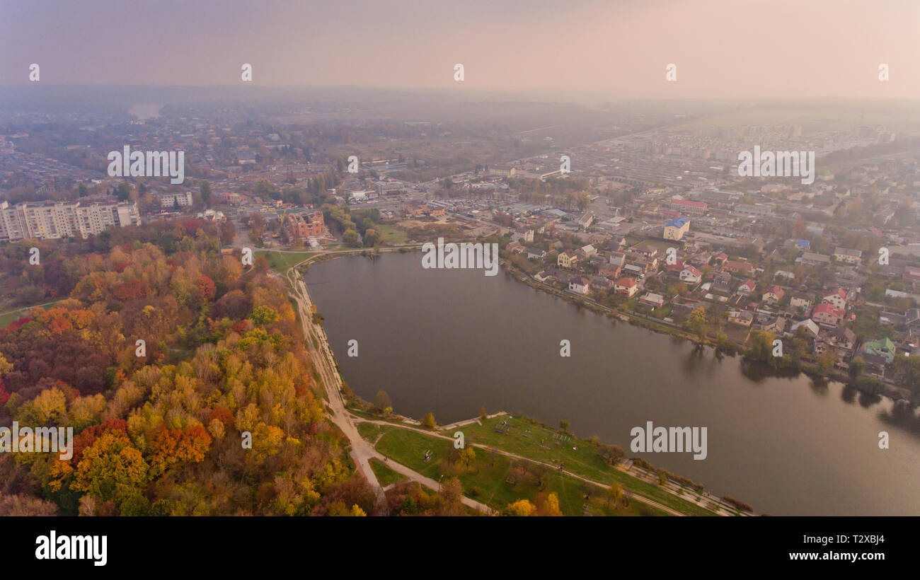 Aerial view of the autumn city park near the lake. Beautiful view of ...