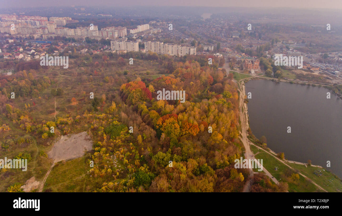 Aerial view of the autumn city park near the lake. Beautiful view of ...