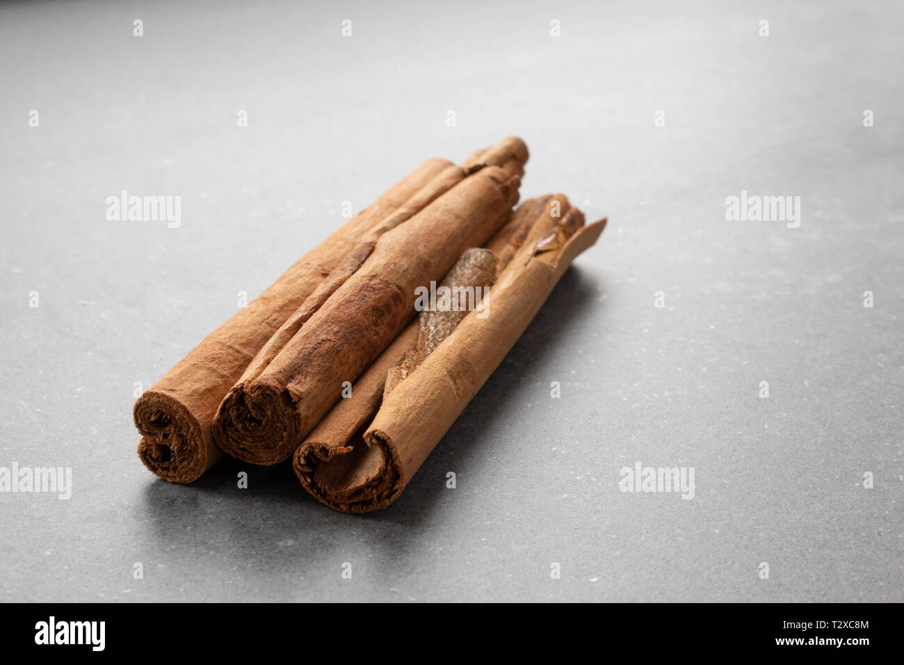 cinnamon sticks on gray background Stock Photo