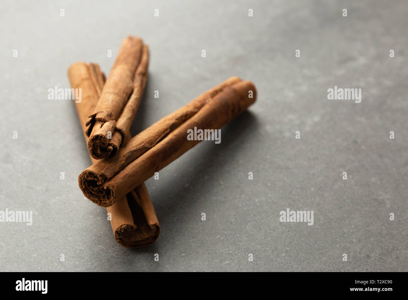 cinnamon sticks on gray background Stock Photo