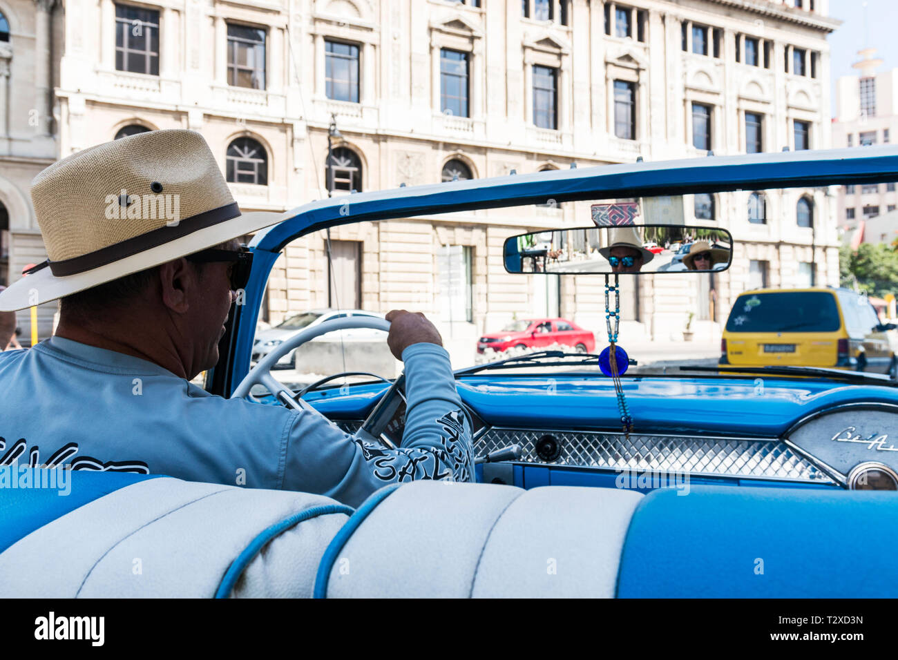 Havana Cuba - 25 July 2018: View from behind our taxi driving who is driving a blue 1950's Chevy Belair in Havana Cuba. Stock Photo