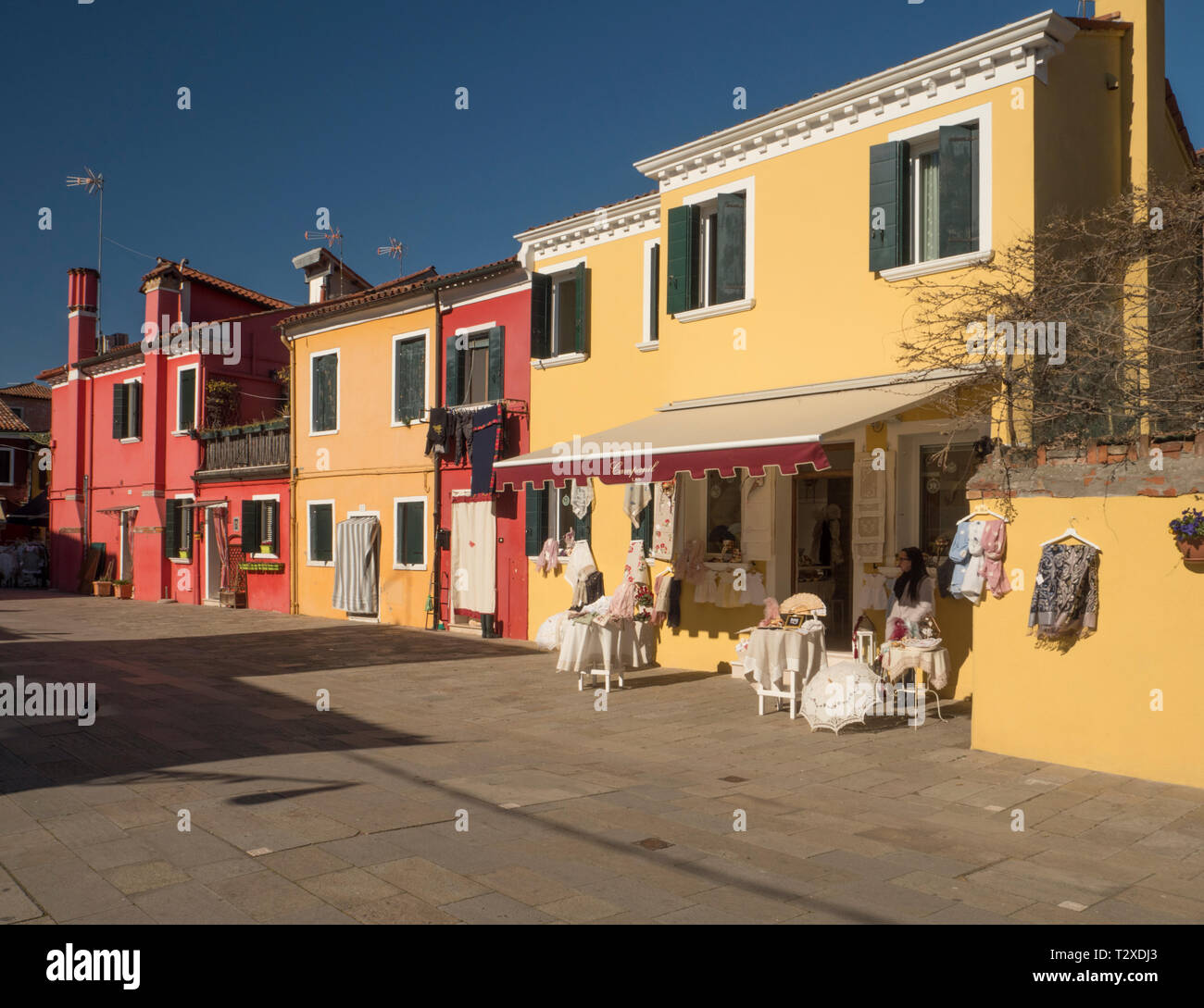 Colourful buildings, including a Lace Shop, on the island of Burano, Venice. Stock Photo