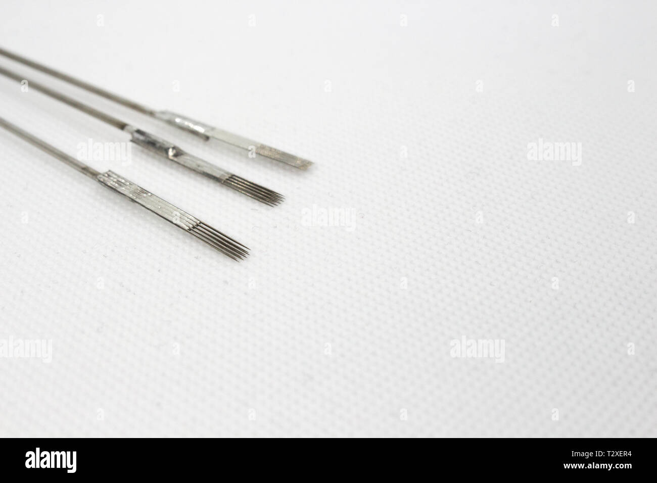 Tattoo needle, equipment, tattoo ink on white background Stock Photo