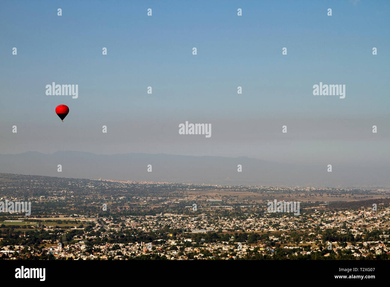 Panoramic view concept. Hot air balloon flying over Mexico city. Stock Photo