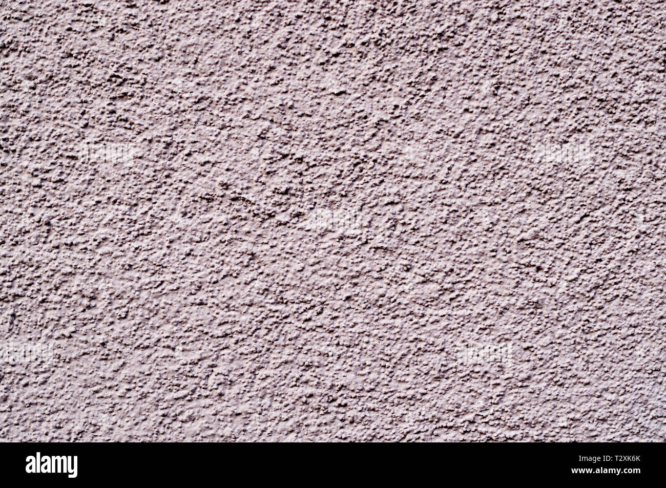 light-pink painted relief wall. background, texture. Stock Photo