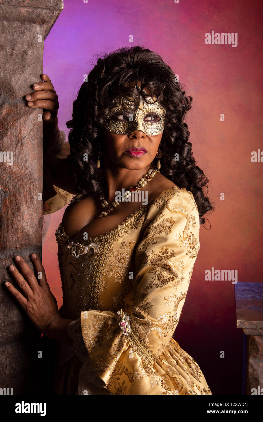 A middle aged, Puerto Rican, woman at a masquerade party. Stock Photo