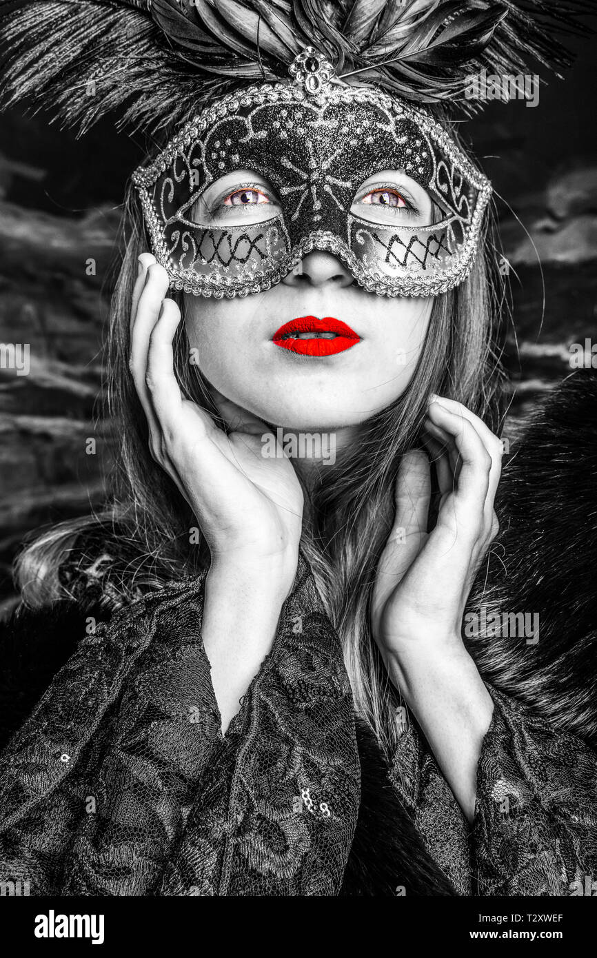 A woman dressed up at a masquerade ball. Stock Photo