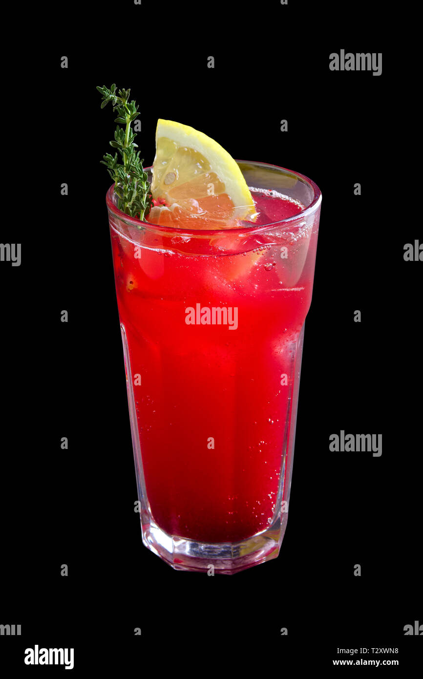 Glass of cranberry and lemon lemonade isolated on black Stock Photo
