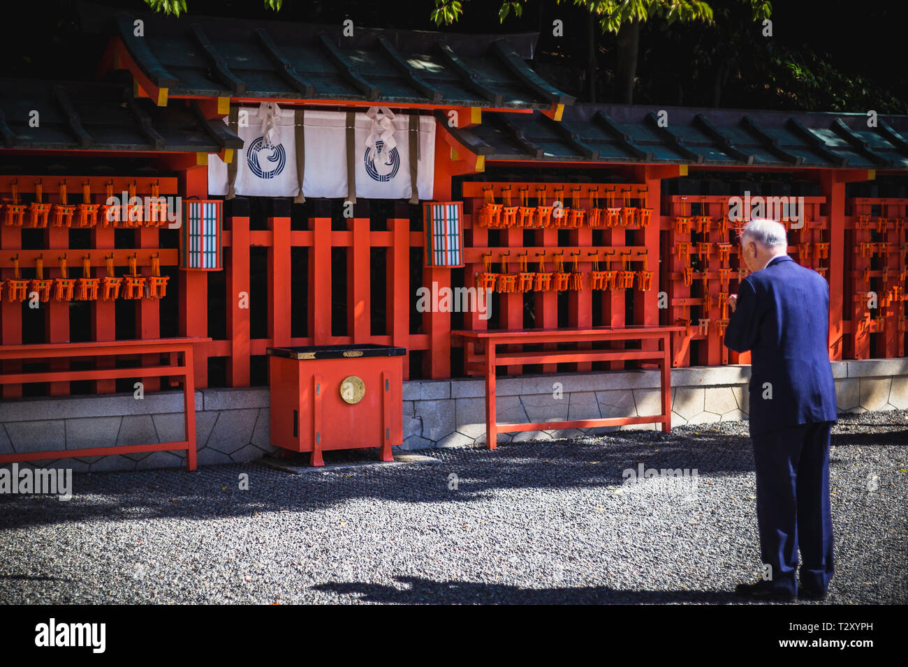 Worshipper at Fushimi Inari Shrine in Kyoto, Japan Stock Photo