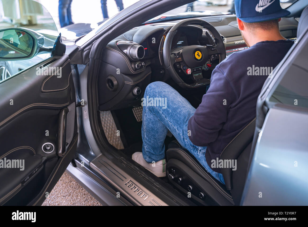 Valencia,Spain - March 30, 2019: Sitting in a Ferrari. Man in a