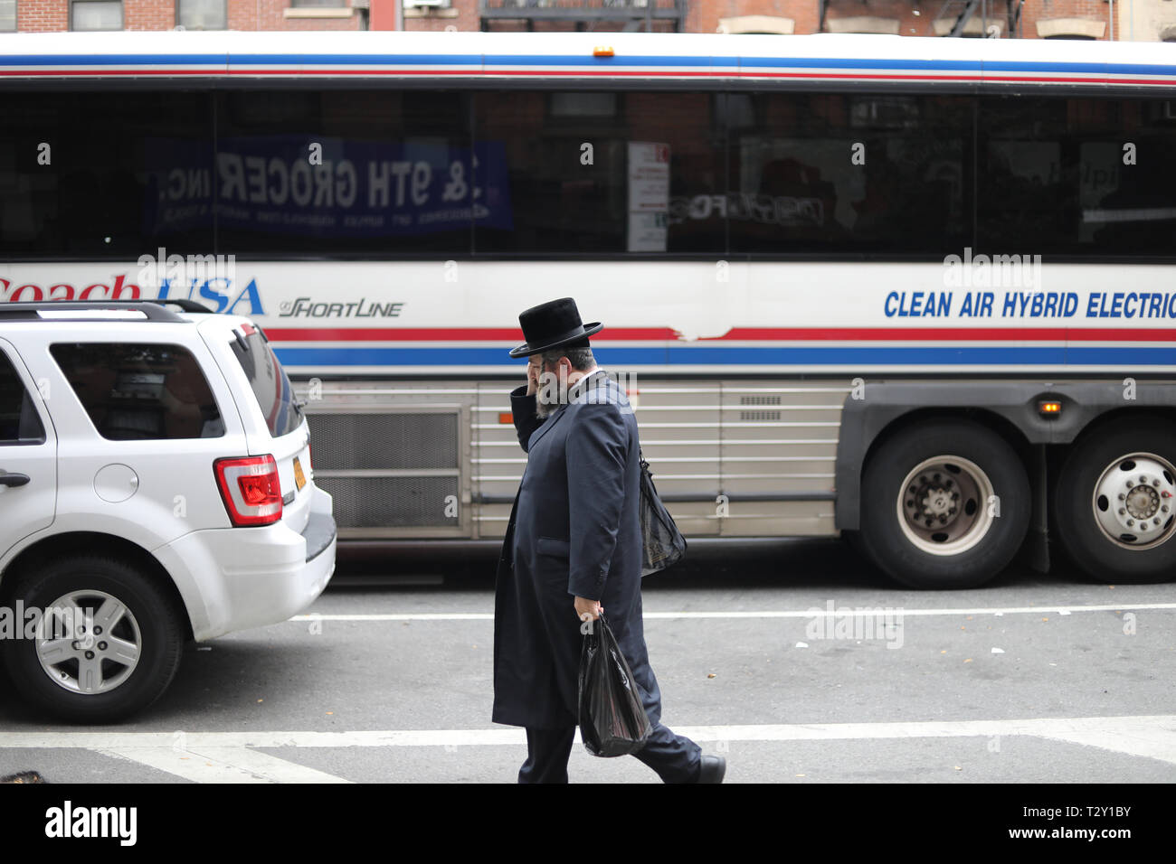 Unidentified jewish man walking in the streets of Manhattan, NY Stock Photo