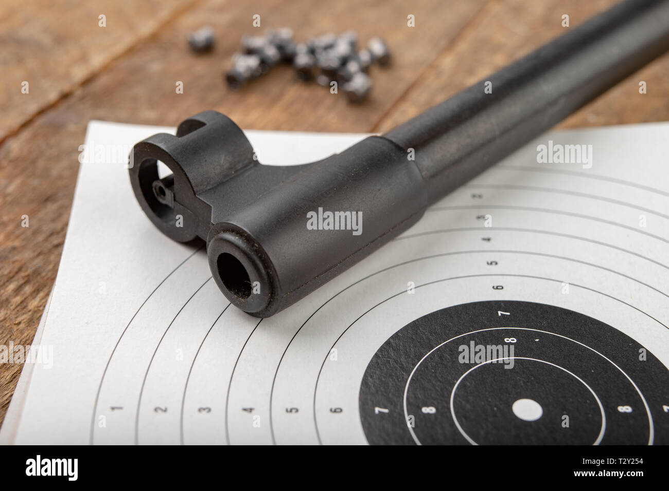 A pneumatic weapon on a wooden table on a shooting range. Shooting