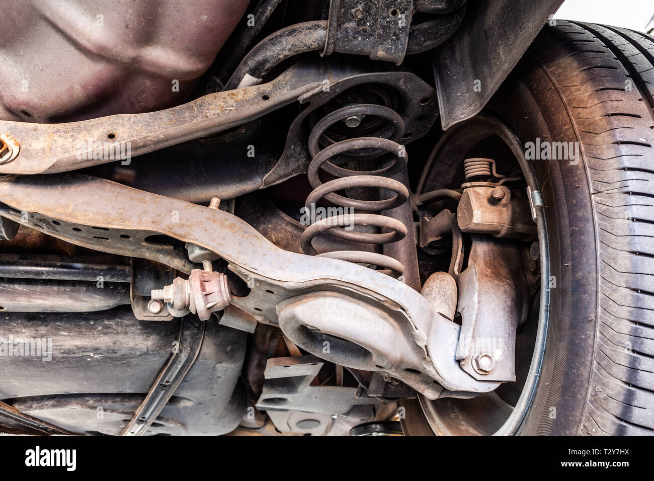 Used vehicle shock absorber and control arm in a repair shop Stock