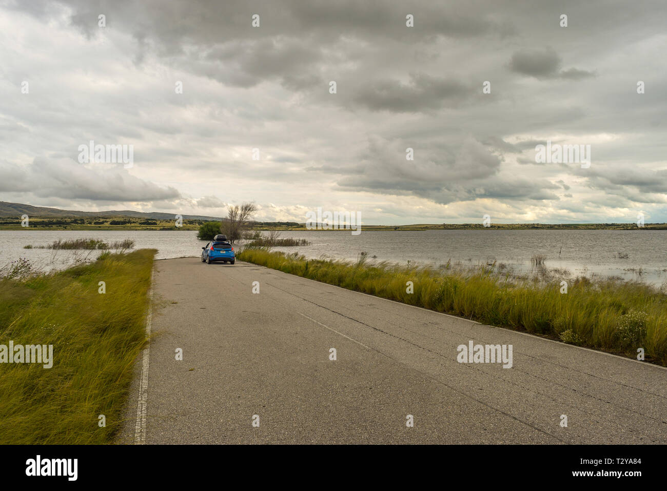 Windy road and car hi-res stock photography and images - Alamy