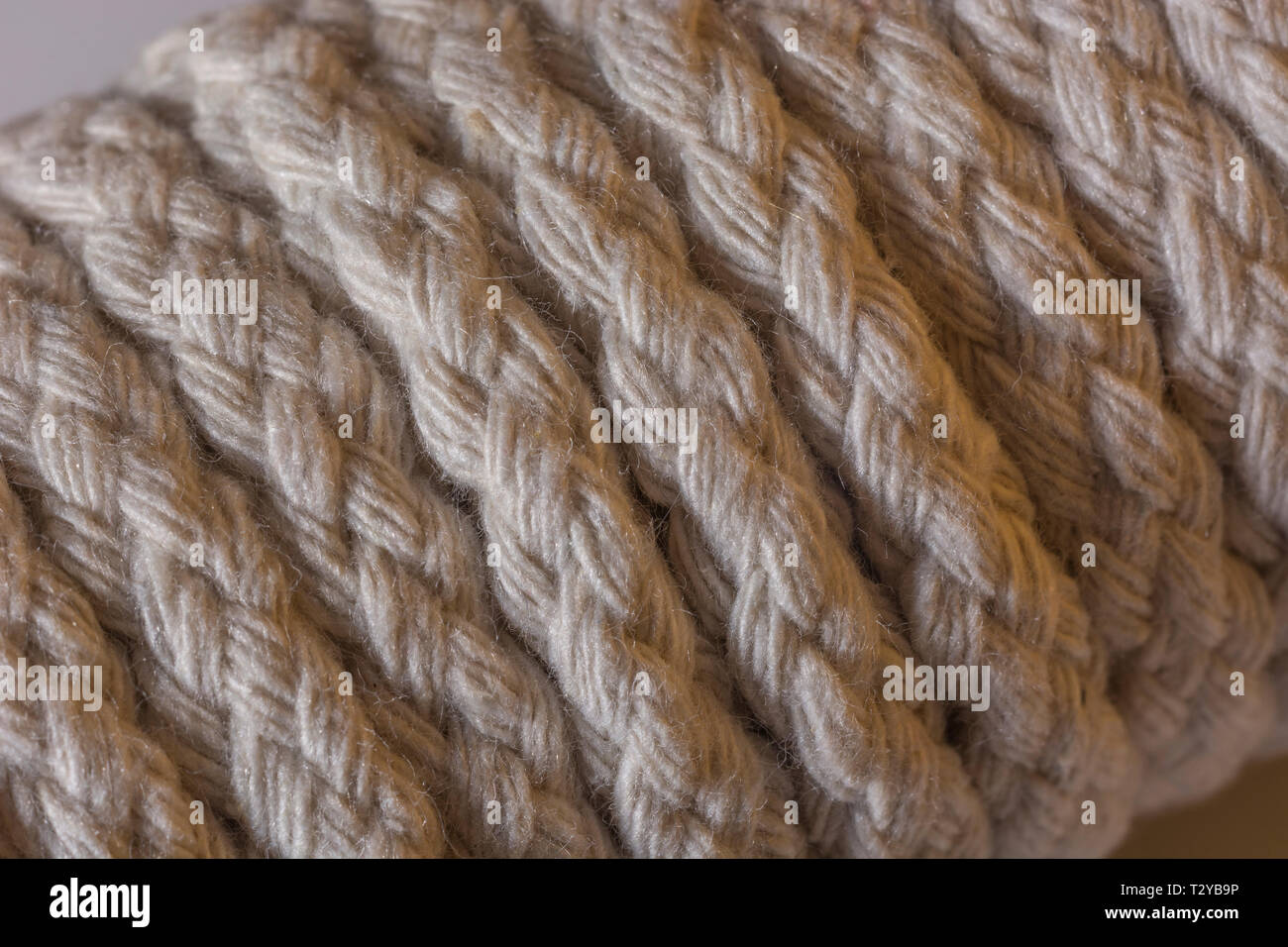 Close-up of a hank of natural multi-strand cotton cord - used for clotheslines and other jobs. Metaphor 'given enough rope'. Stock Photo