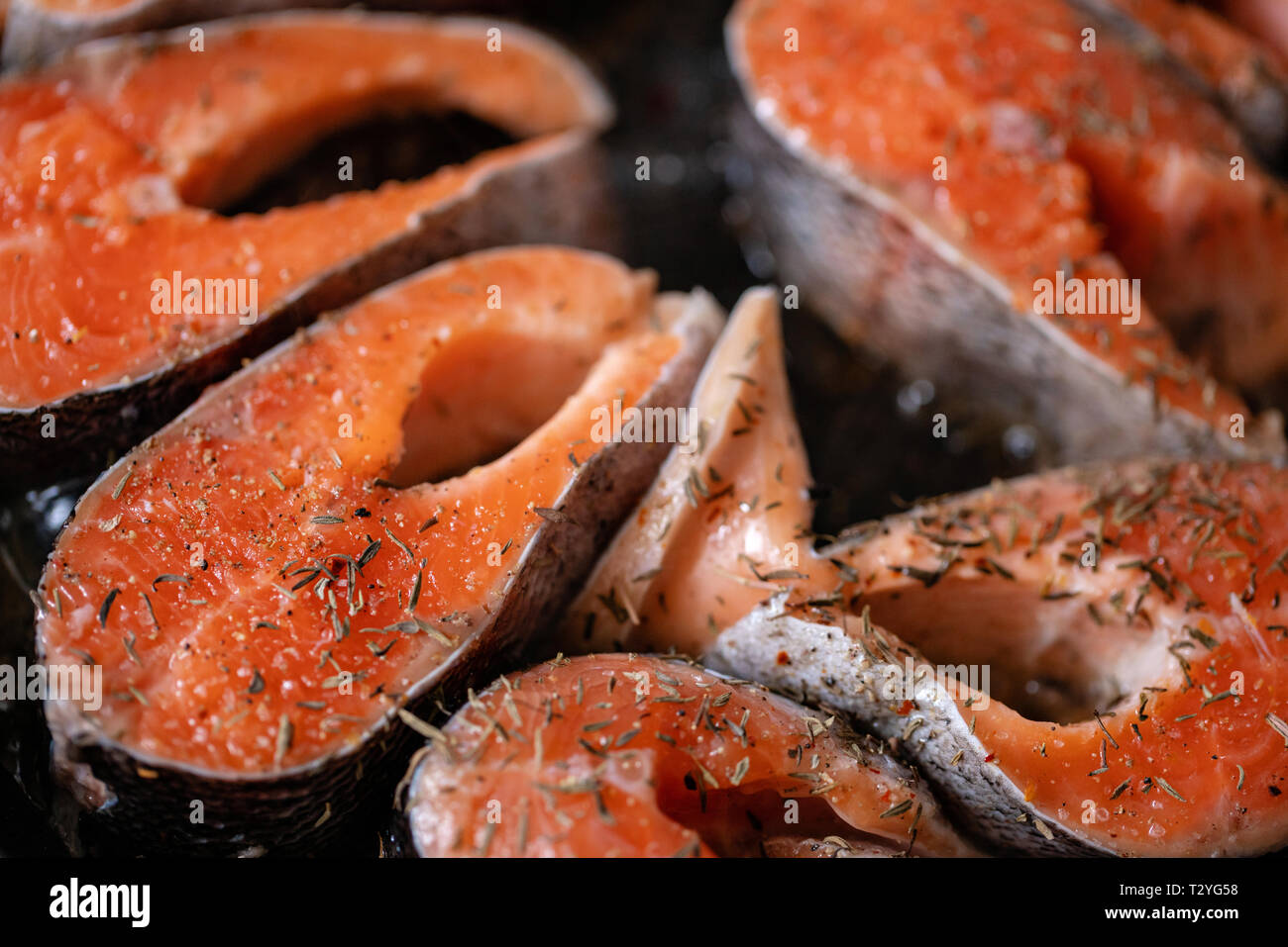 Slice Of Raw Pink Salmon Steak For Restaurant Menu Close Up On Natural  Black Stone Background. Thick Piece Of Fresh Red Fish, Chum Or Trout Stock  Photo, Picture and Royalty Free Image.