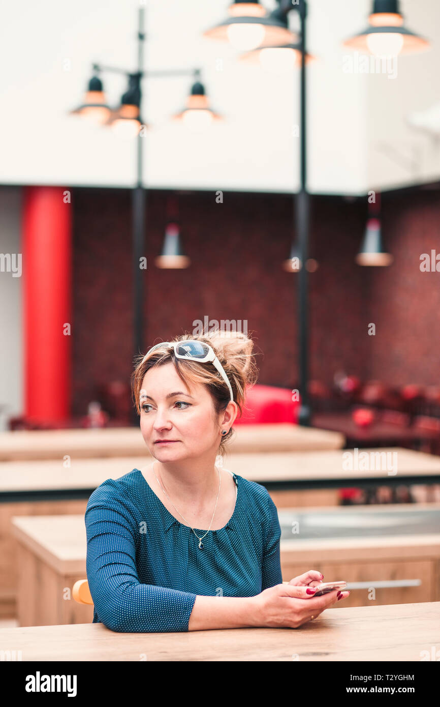 Woman mobile phone inside restaurant hi-res stock photography and ...