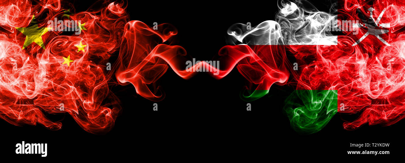 China vs Oman, Omani smoke flags placed side by side. Thick colored
