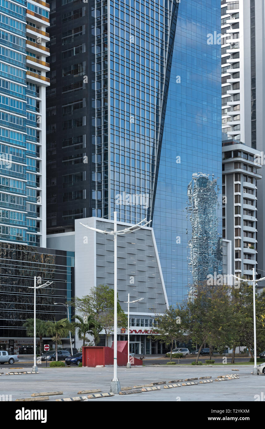 reflection of a neighboring house in the facade of a skyscraper in panama city Stock Photo