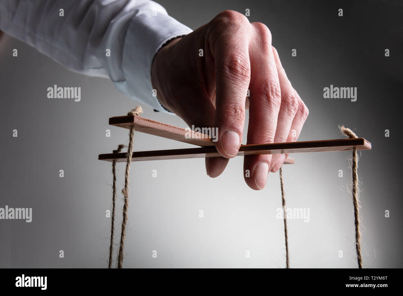 The Human Hand with Marionette on the Strings. Stock Image - Image