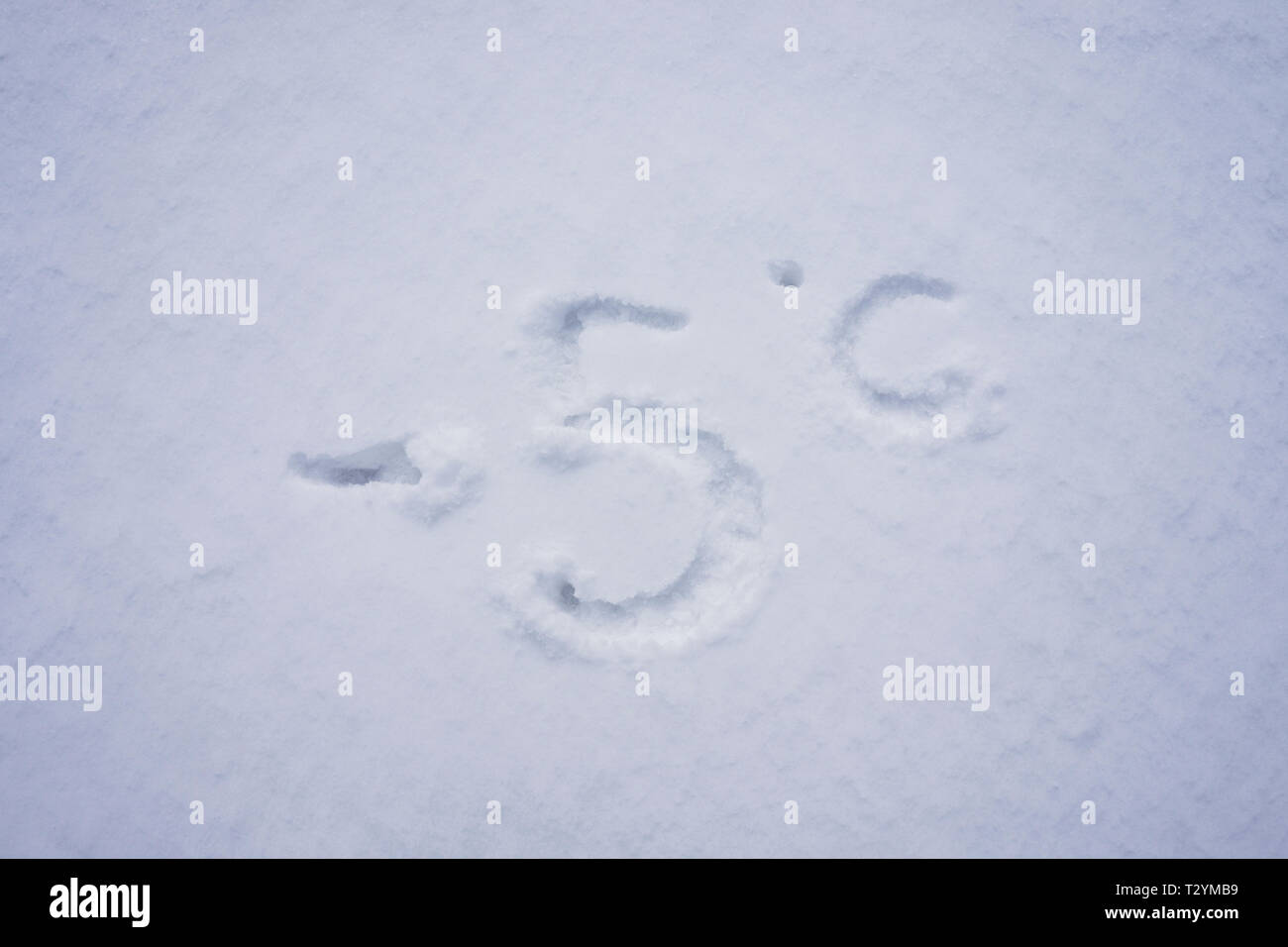 minus 3 degree celsius written into a snow background Stock Photo