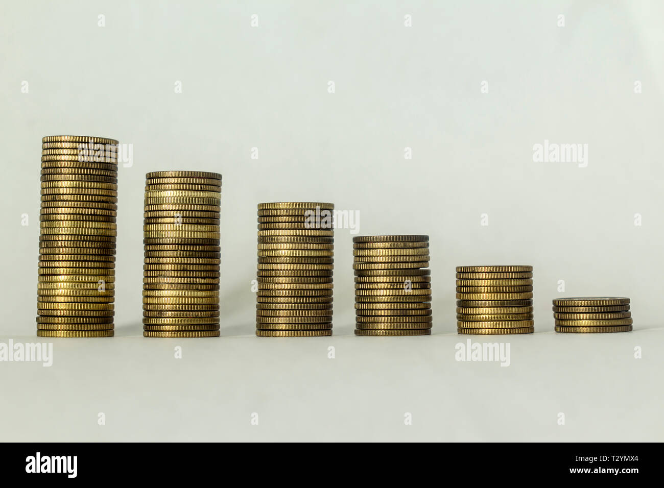Stacks of copper coins on a white background. Ascending movement. A ...