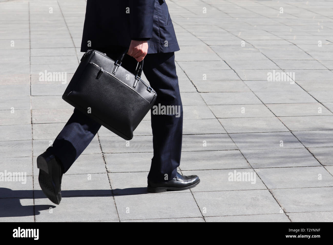 Businessman with portfolio in a hurry hi-res stock photography and ...