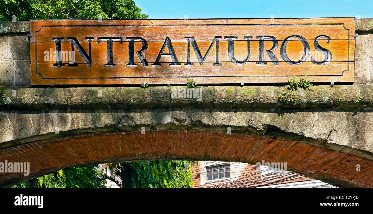 Manila, Philippines: Wooden signage at an entrance gate to the historic walled city of Intramuros, built in the Spanish period Stock Photo