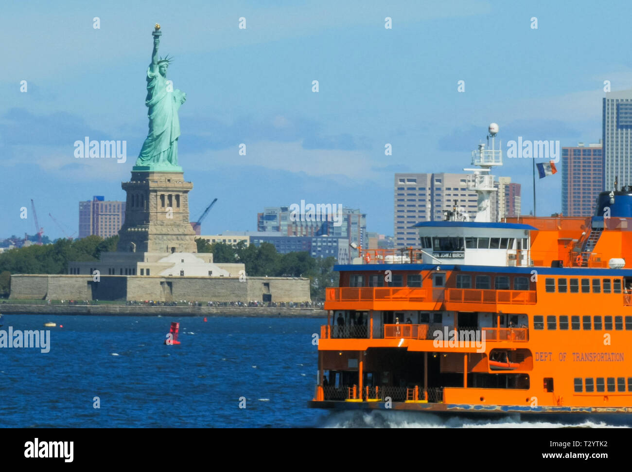 NEW YORK, NEW YORK, USA - SEPTEMBER 15, 2015: close up of the famous staten island ferry with the statue of liberty in the background Stock Photo