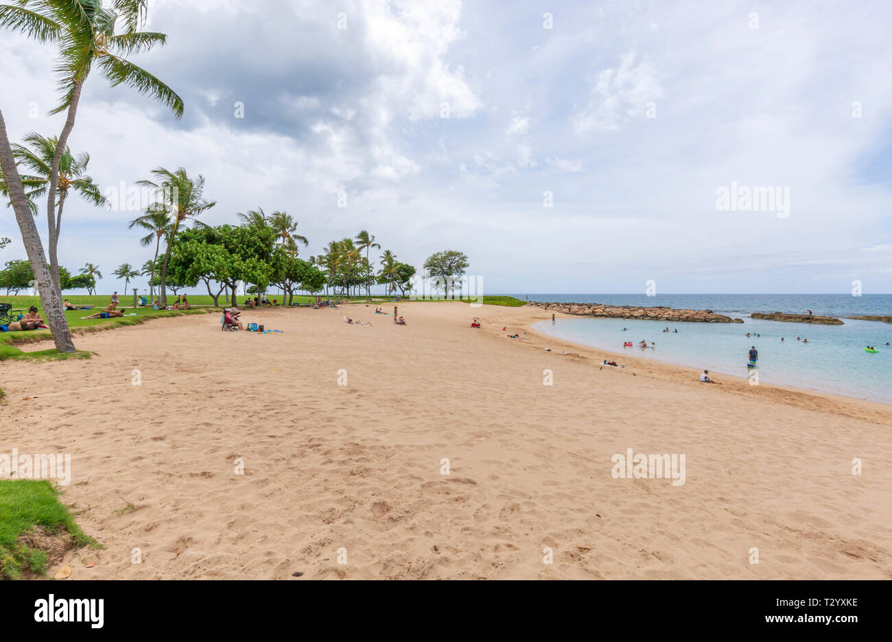 People enjoying the Beach at Ko olina Lagoons Beach park on Oahu Hawaii Stock Photo