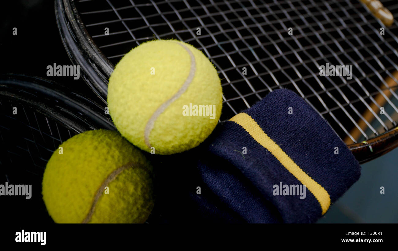 Old or used tennis ball, racket tennis and hand wrist strap isolated in ...