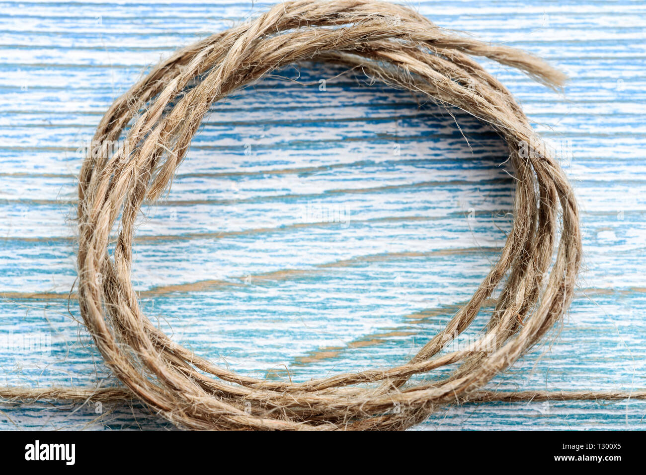 Frame on a wooden background of jute twine Stock Photo