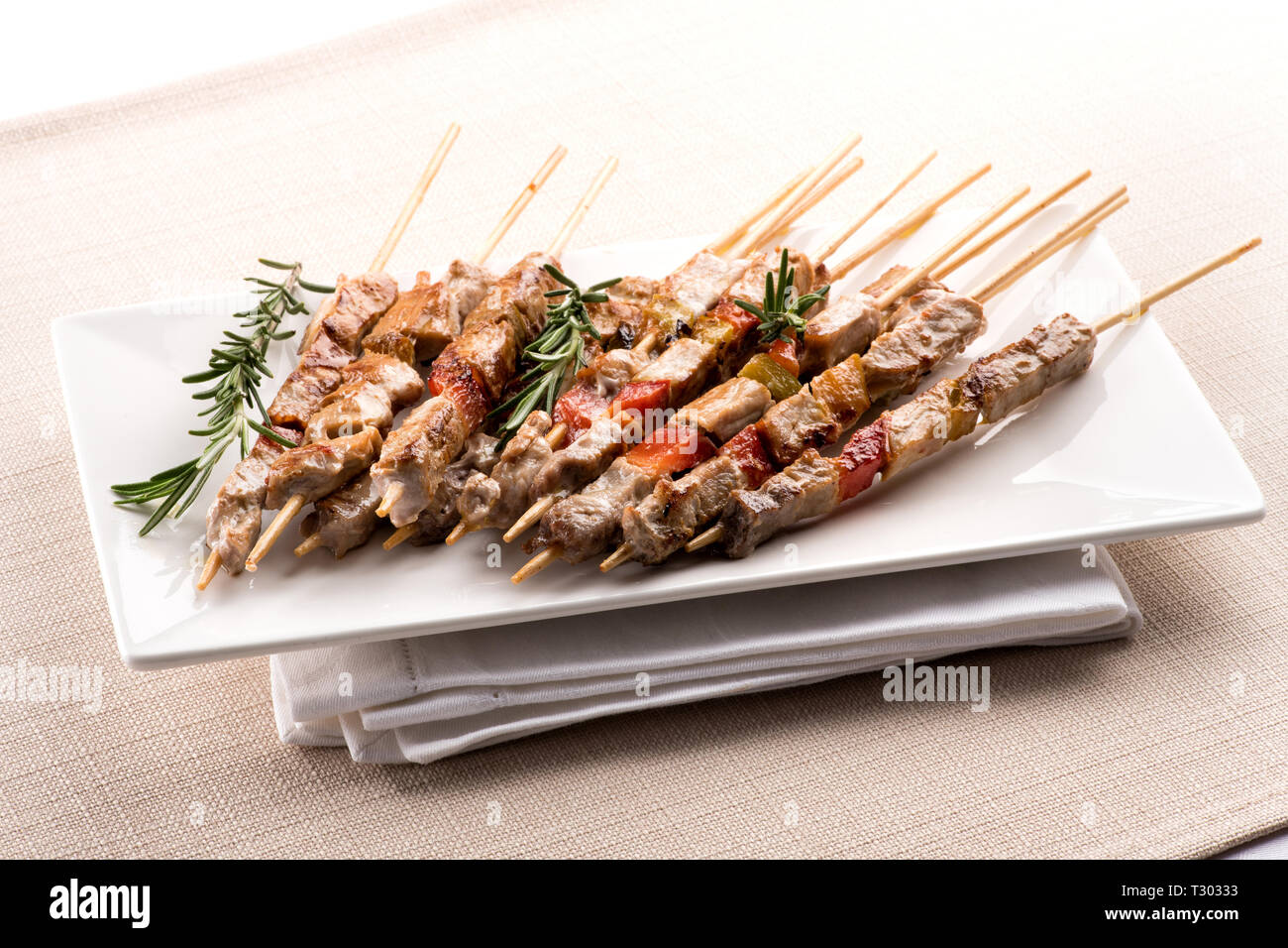 Arrosticini, or lamb skewers cooked over a canala brazier, from the Abruzzo  region of Southern Italy served on a plate on a folded napkin Stock Photo -  Alamy