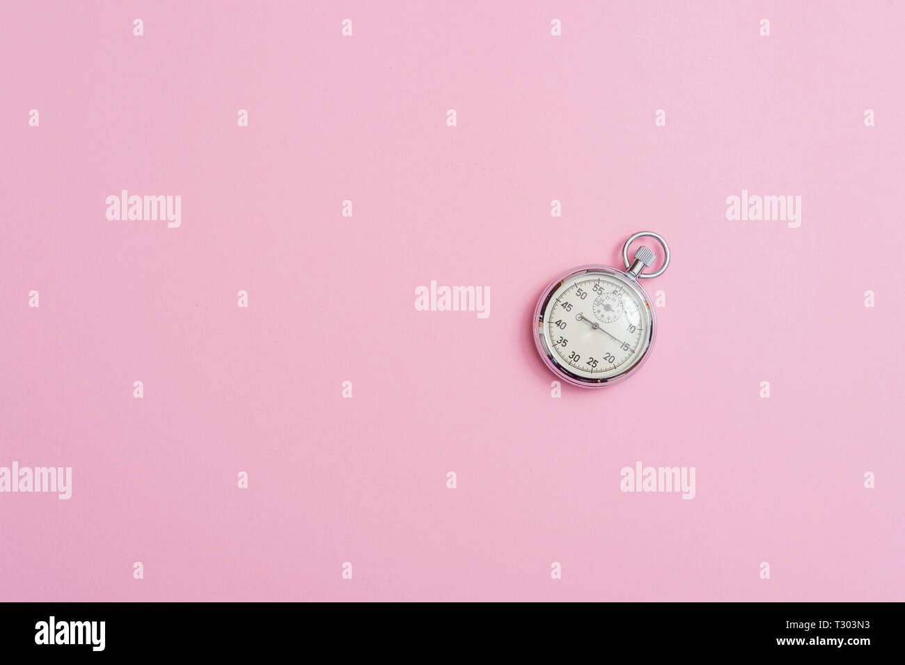 Analogue metal stopwatch on the pink background Stock Photo - Alamy