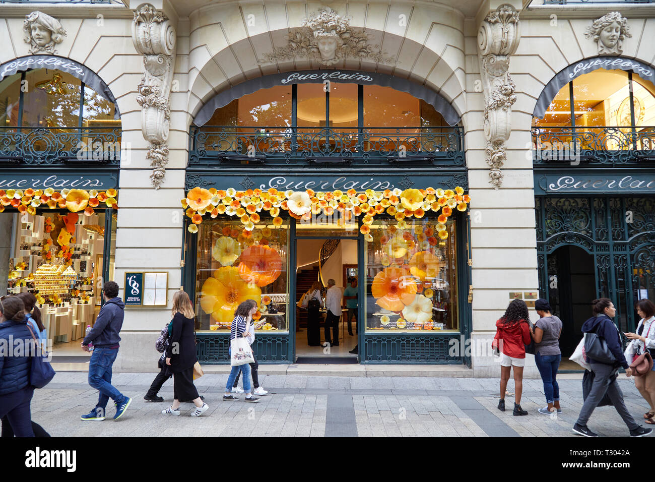 PARIS, FRANCE - JULY 22, 2017: Guerlain cosmetics luxury store in Paris, people passing, France. Stock Photo