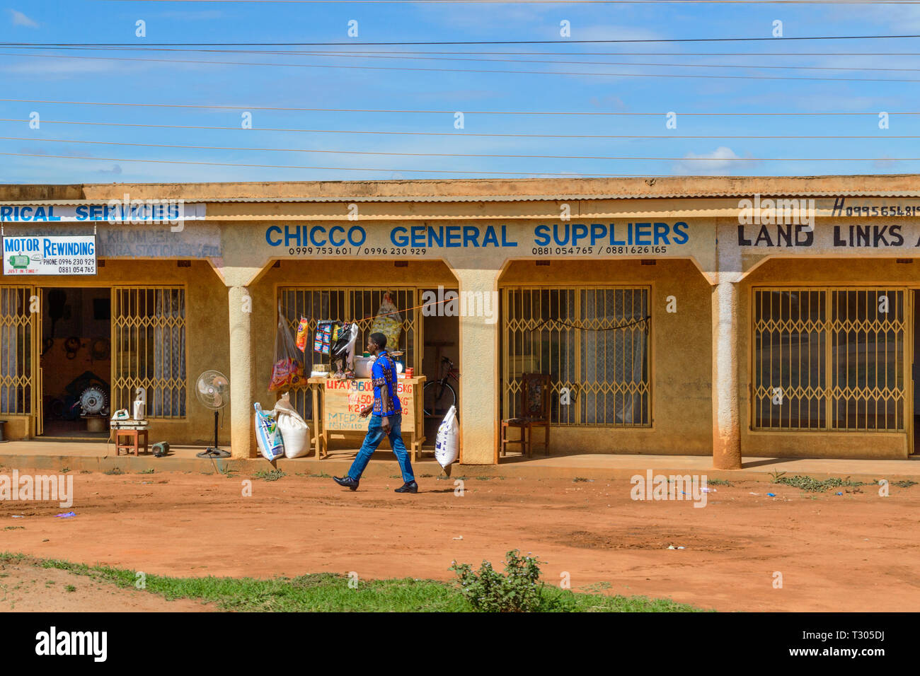a row of roadside shops Lilongwe Malawi one selling maize flour in sacks Stock Photo