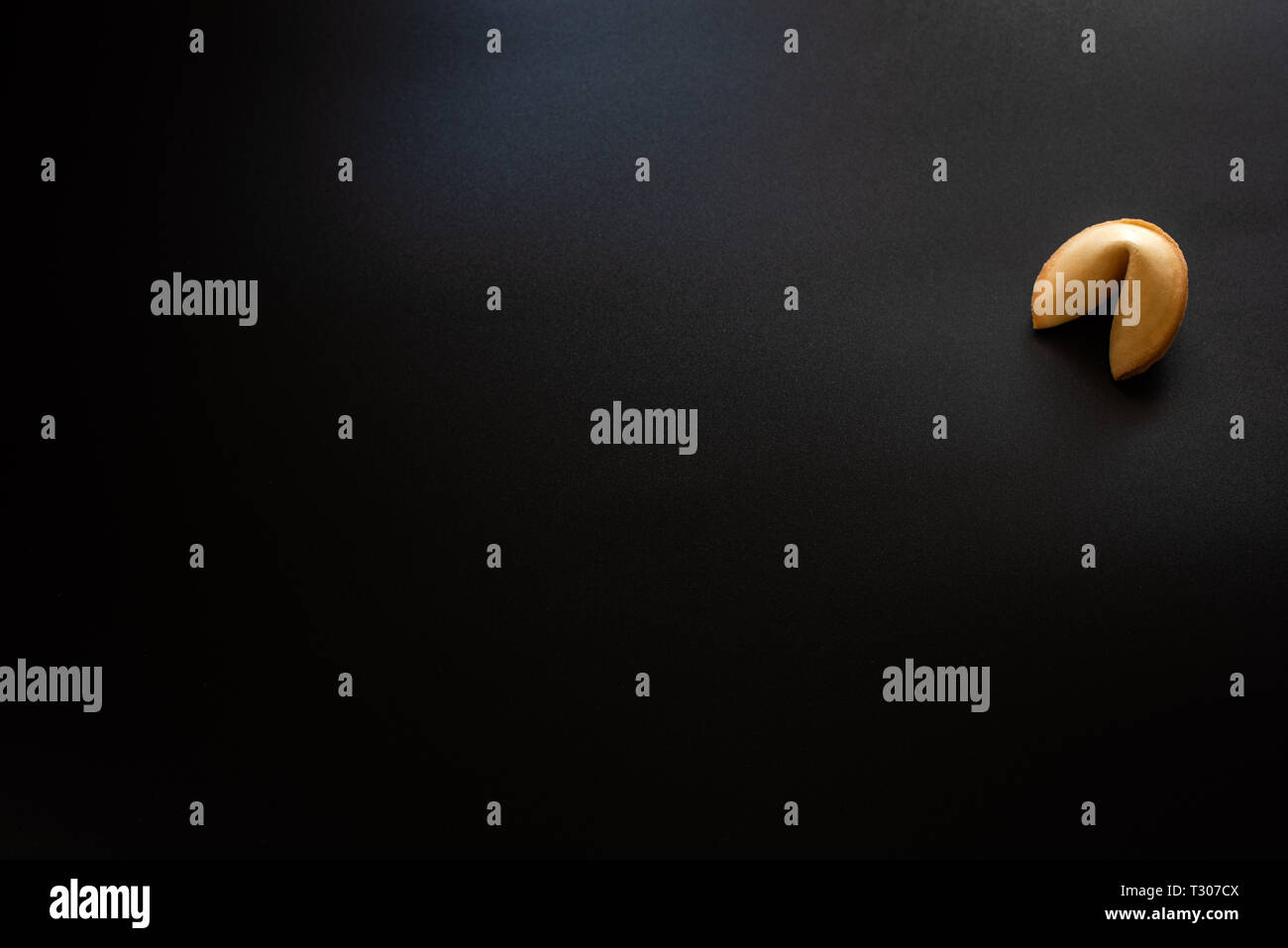 Fortune cookies on black background Stock Photo - Alamy