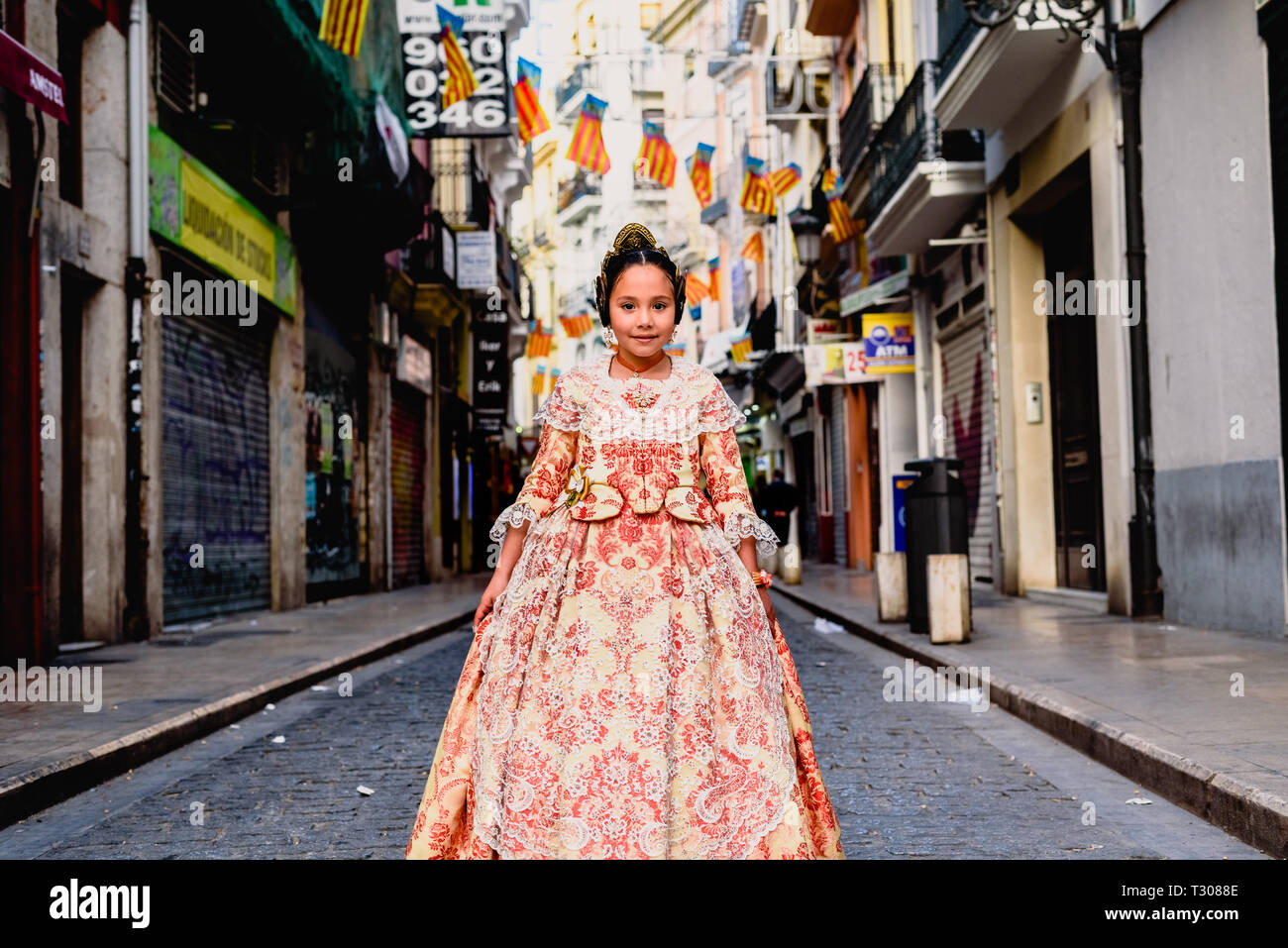 Portrait of a latina fallera girl wearing the traditional valencian ...