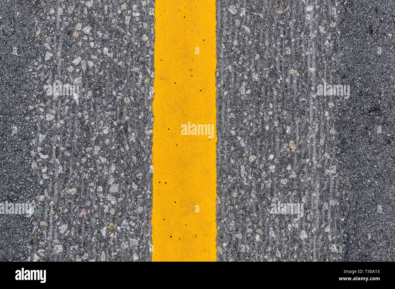Close-up of the yellow line road marking Stock Photo
