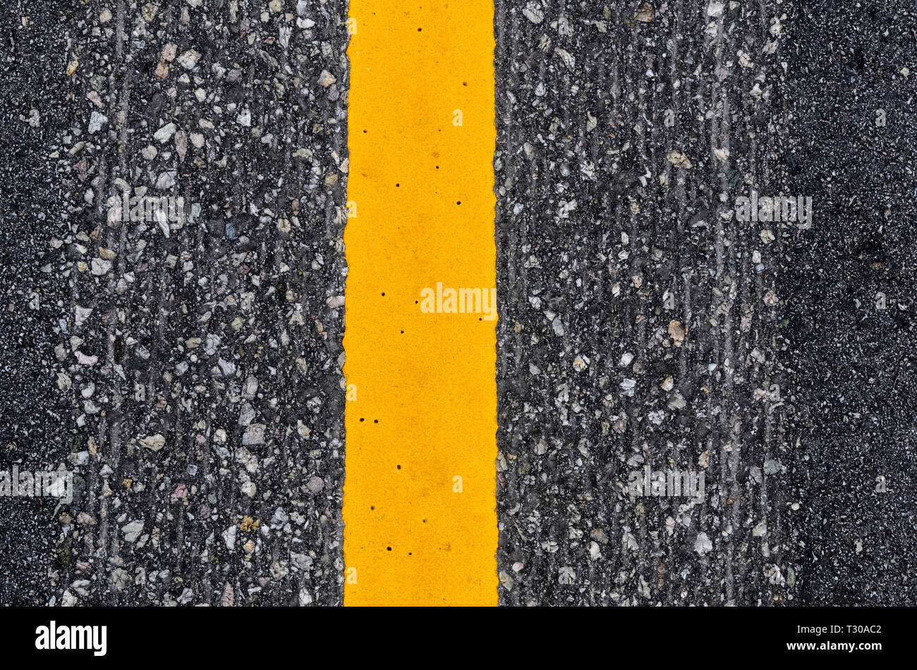 Closeup of the yellow line road marking Stock Photo Alamy