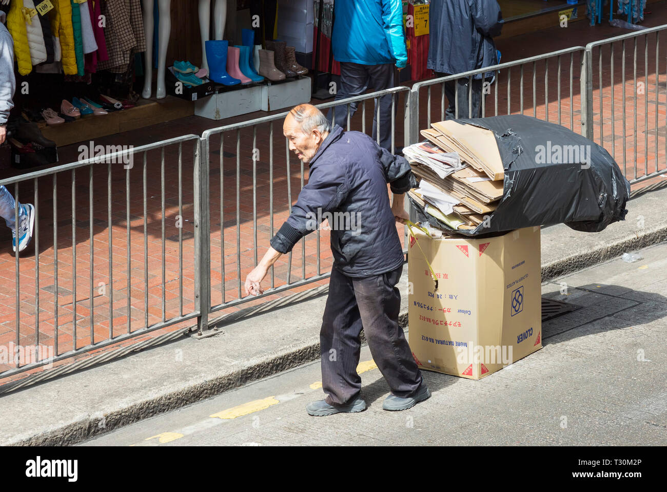 Old Chinese man recycling waste, Hong Kong, SAR, China Stock Photo