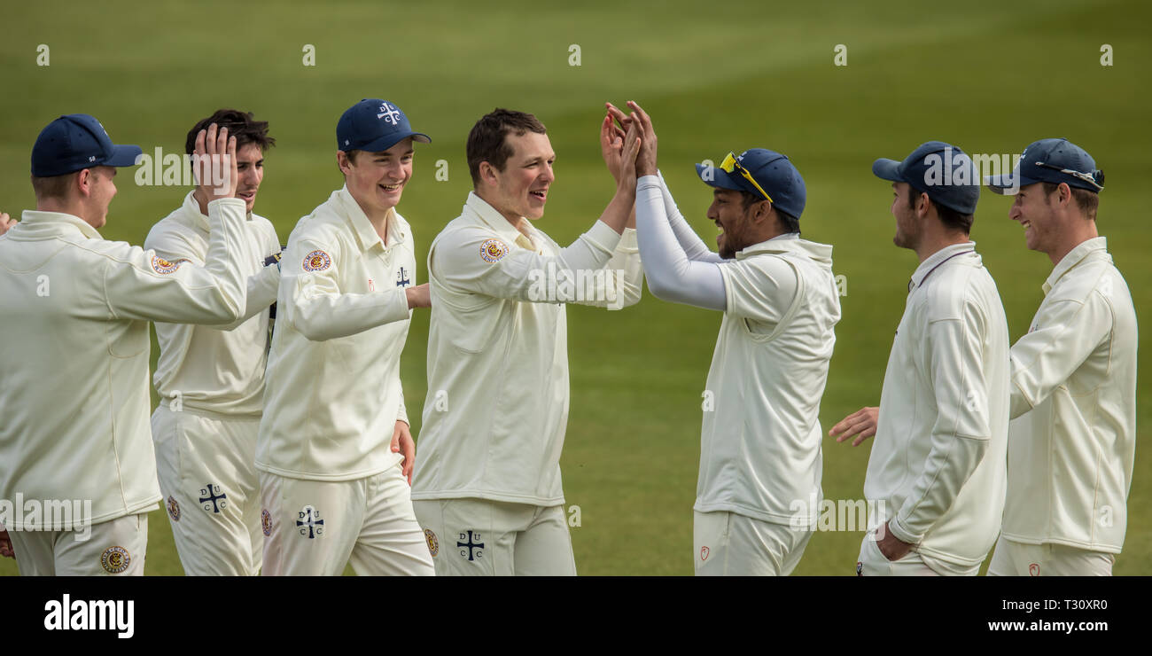 London, UK. 5th Apr, 2019. Bowler Benedict Graves high-fives Niall Solomon after he takes a good catch on the boundary to get rid of Ben Foakes as Surrey take on Durham MCCU at the Kia Oval on day two of the 3 day match. Credit: David Rowe/Alamy Live News Stock Photo