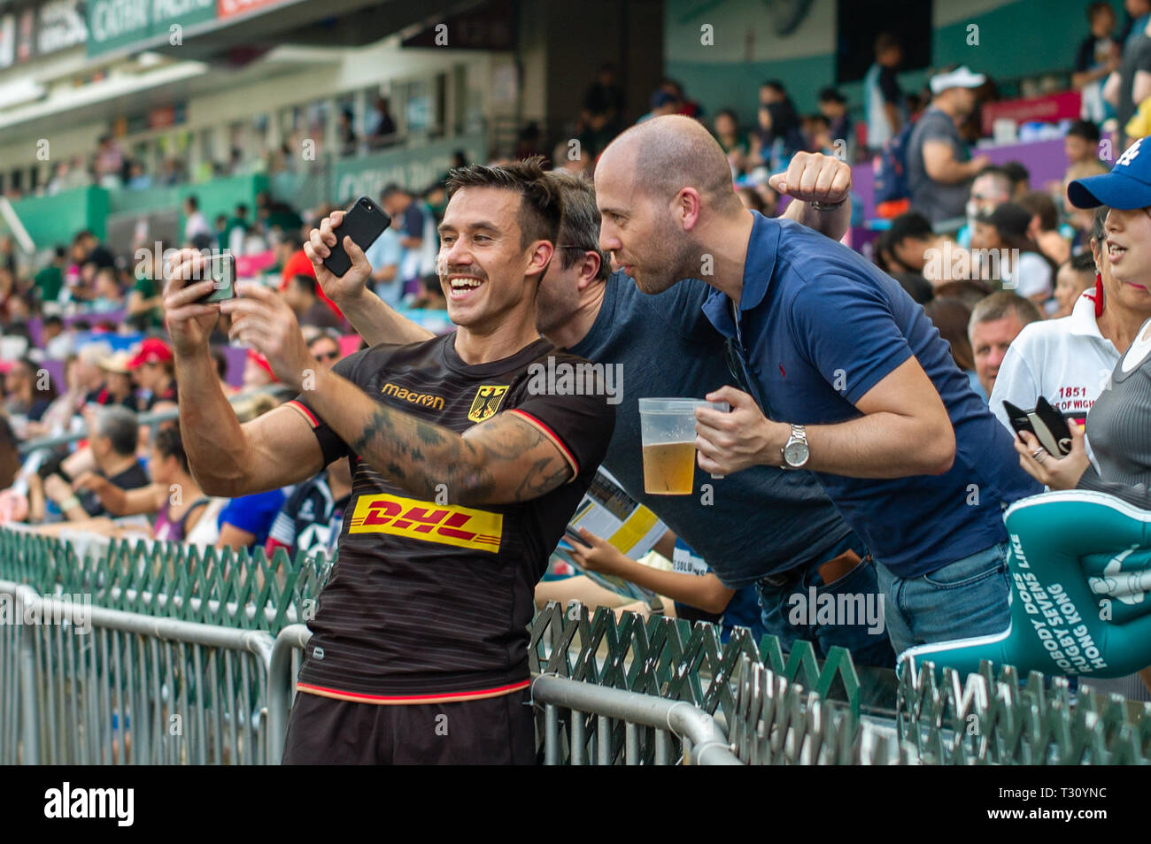 Hongkong, China. 05th Apr, 2019. Rugby tournament on 05.04.2019 in Hong Kong. Group game Germany - Cook Islands: Tim Biniack (Germany) makes selfies with spectators. Credit: Juergen Kessler/Enterpress/dpa/Alamy Live News Stock Photo