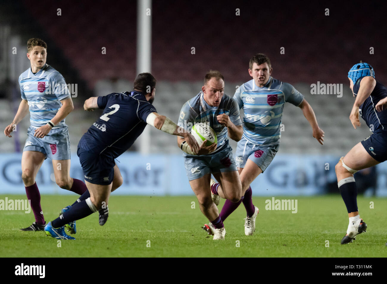 London, UK. 05th Apr, 2019. FLT LT Rob Bell (centre) of Royal Air Force is tackled by LPT Ben Priddey of Navy (left) during Royal Air Force Men's Senior XV vs Royal Navy Senior XV at Twickenham Stoop on Friday, 05 April 2019. (Editorial use only, license required for commercial use. No use in betting, games or a single club/league/player publications.) Credit: Taka Wu/Alamy Live News Stock Photo