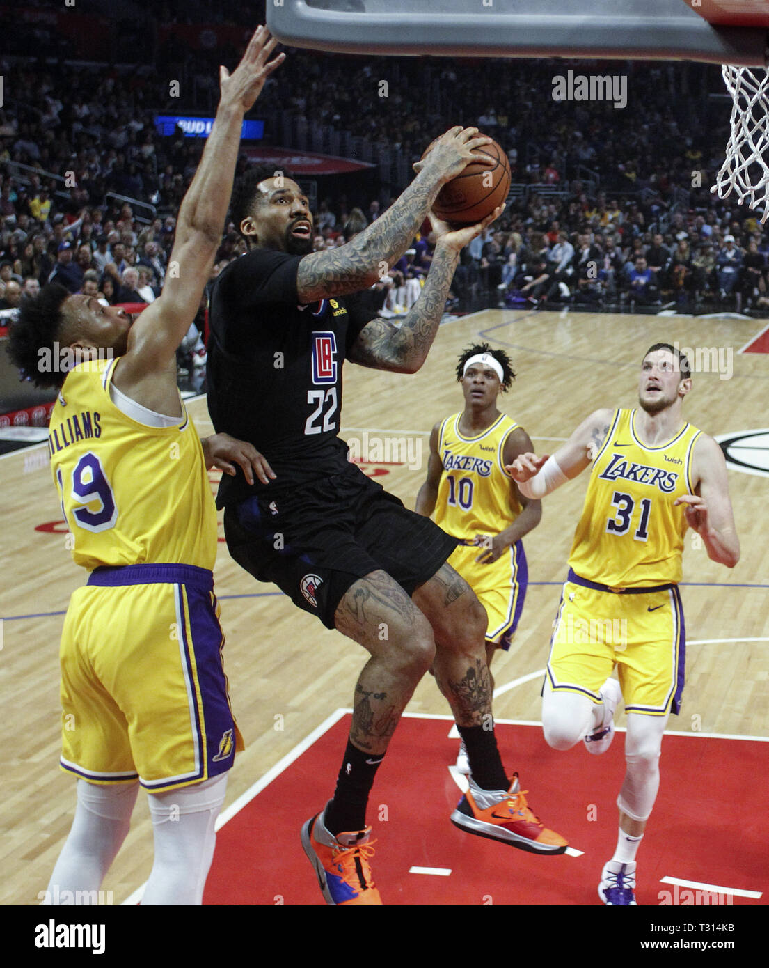 Los Angeles, California, USA. 5th Apr, 2019. Los Angeles Clippers' Wilson  Chandler (22) goes up to the basket while defended by Los Angeles Lakers'  Johnathan Williams (19) during an NBA basketball game