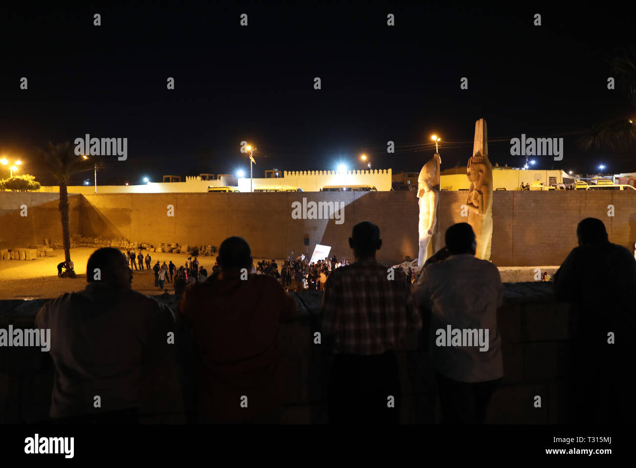 Sohag, Egypt. 5th Apr, 2019. People view a revived statue of Ramses II in Sohag, Egypt, April 5, 2019. Egyptian archeologists have pieced on Friday 70 fragments to revive a large statue of Ramses II in the upper Egypt's province of Sohag. Ramses II was the third pharaoh of the Nineteenth Dynasty of Egypt and was considered the strongest pharaoh of the New Kingdom that spans from the 16th century BC to the 11th century BC. Credit: Ahmed Gomaa/Xinhua/Alamy Live News Stock Photo