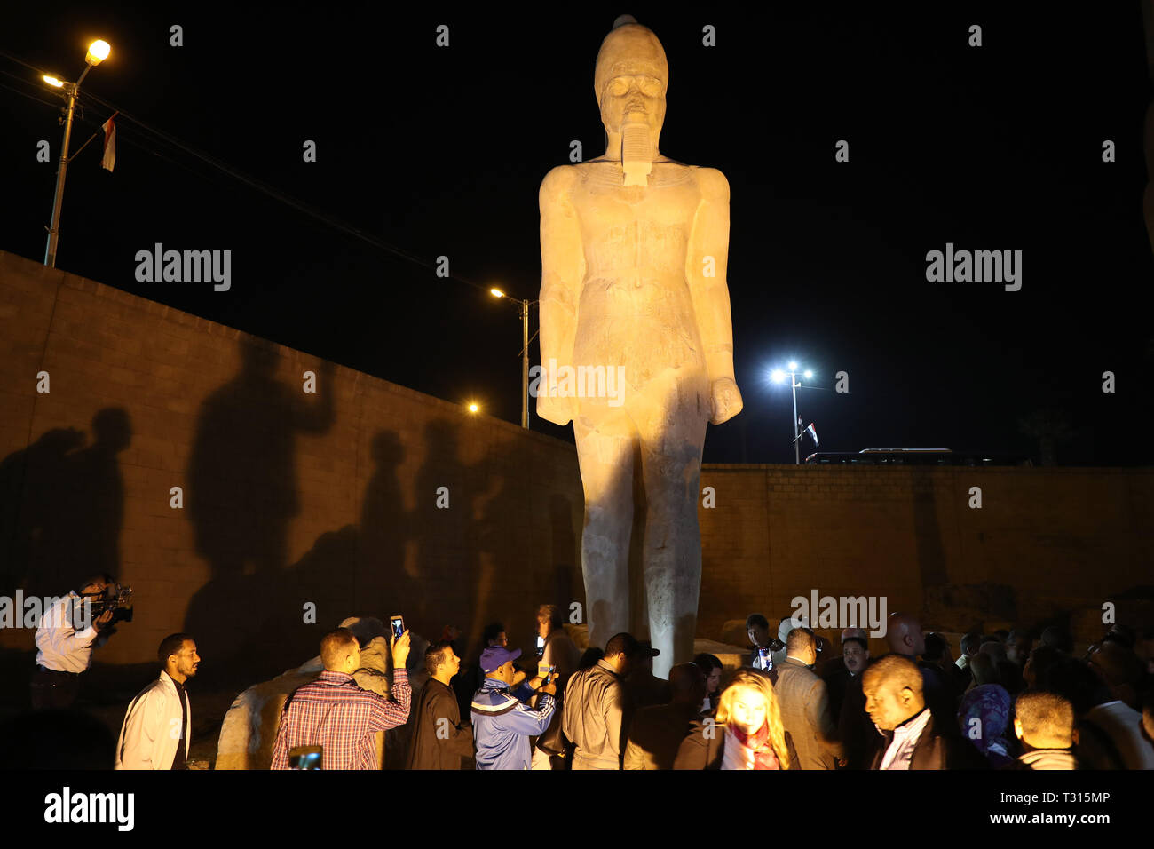 Sohag, Egypt. 5th Apr, 2019. People view a revived statue of Ramses II in Sohag, Egypt, April 5, 2019. Egyptian archeologists have pieced on Friday 70 fragments to revive a large statue of Ramses II in the upper Egypt's province of Sohag. Ramses II was the third pharaoh of the Nineteenth Dynasty of Egypt and was considered the strongest pharaoh of the New Kingdom that spans from the 16th century BC to the 11th century BC. Credit: Ahmed Gomaa/Xinhua/Alamy Live News Stock Photo